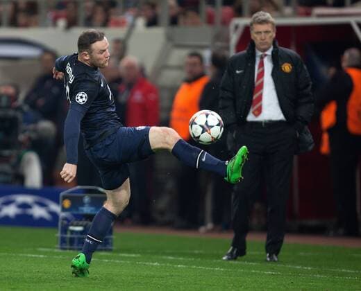 David Moyes, manager of Manchester United watches on over Wayne Rooney - UEFA Champions League First Knockout Round - Olympiacos vs. Manchester United - Karaiskakh Stadium - Athens - Greece - 25th February 2014 - EDITORIAL USE ONLY. No use with unauthorised audio, video, data, fixture lists, club league logos or live services. Online in-match use limited to 120 images, no video emulation. No use in betting, games or single club league player publications.