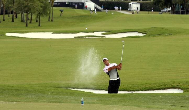 March 5, 2014 - Doral, FL, USA - Tiger Woods hits a practice shot at the WGC-Cadillac Championship at Trump National Doral in Doral, Fla., on Wednesday, March 5, 2014. Trump National Doral - ZUMAm67