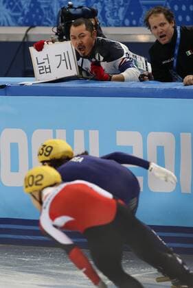 Feb. 10, 2014 - Sochi, Russia - A Korean coach yells instructions during the mens 1500m short track speed skating finals during the Sochi 2014 Olympic Winter Games at Iceberg Skating Palace. Men s Short Track Speed Skating - Sochi 2014  - ZUMAm11