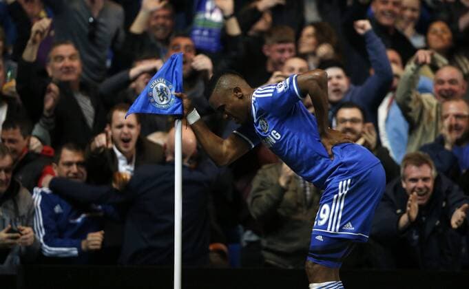 Samuel Eto o of Chelsea celebrates scoring during the Barclays Premier League match between Chelsea FC and Tottenham Spurs at Stamford Bridge Stadium in London, Britain, on March 8, 2014. (Xinhua Wang Lili) 