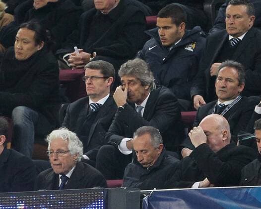 Manchester City s Manuel Pellegrini looks on dejected from the stands Barcelona v Manchester City - Champions League last 16, second leg - Nou Camp - Barcelona - Spain - 12 03 2014 - Pic David Klein Sportimage EDITORIAL USE ONLY. No use with unauthorised audio, video, data, fixture lists, club league logos or live services. Online in-match use limited to 120 images, no video emulation. No use in betting, games or single club league player publications.