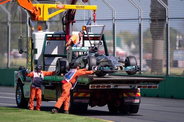 (140314) -- MELBOURNE, March 14, 2014 (Xinhua) -- The car of Mercedes GP Formula one driver Lewis Hamilton of Great Britain is towed away during the first practice session of the Australian Formula One Grand Prix at Albert Park in Melbourne, Australia, March 14, 2014. (Xinhua Bai Xue) (SP)AUSTRALIA-MELBOURNE-F1 