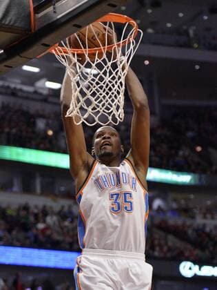 Oklahoma City Thunder forward Kevin Durant dunks during the third quarter against the Chicago Bulls at the United Center in Chicago on March 17, 2014. The Thunder defeated the Bulls 97-85.  CHI2014031713