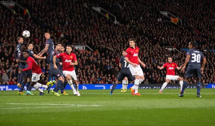 Robin van Persie of Manchester United scores his third goal - UEFA Champions League Round of 16 - Manchester United vs. Olympiacos - Old Trafford - Manchester - England - 19th March 2014 - Picture Philip Oldham Sportimage EDITORIAL USE ONLY. No use with unauthorised audio, video, data, fixture lists, club league logos or live services. Online in-match use limited to 120 images, no video emulation. No use in betting, games or single club league player publications.