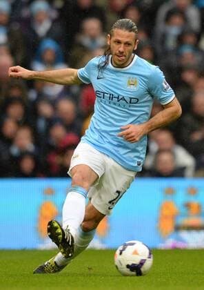 Martin Demichelis of Manchester City - Barclays Premier League - Manchester City vs Fulham - Etihad Stadium - Manchester - England - 22nd March 2014 - Pic Simon Bellis Sportimage EDITORIAL USE ONLY. No use with unauthorised audio, video, data, fixture lists, club league logos or live services. Online in-match use limited to 120 images, no video emulation. No use in betting, games or single club league player publications.