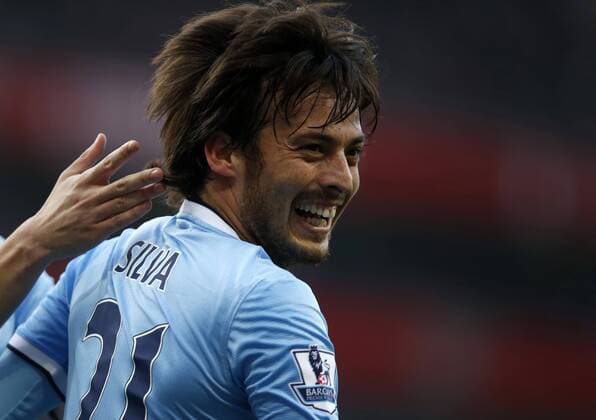 David Silva of Manchester City celebrates scoring during the Barclays Premier League match between Arsenal and Manchester City at Emirates Stadium in London, Britain on March 29, 2014. The match ended with a 1-1 draw. (Xinhua Wang Lili) (SP) LONDON-SOCCER-PREMIER LEAGUE-- ARSENAL FC London VS MANCHESTER CITY