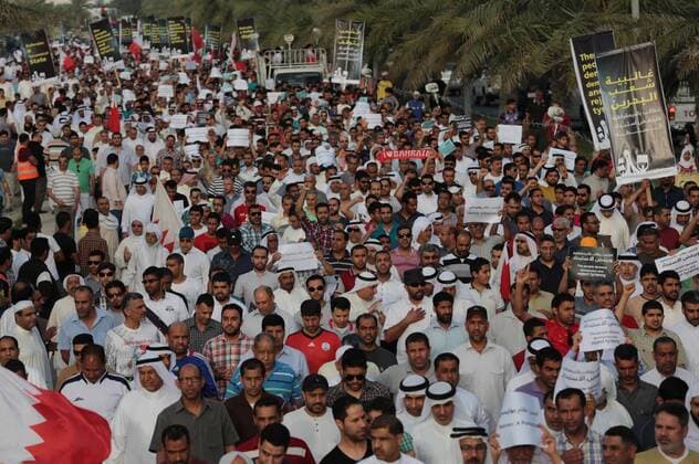 MANAMA, April 4, 2014 - Protesters take part in a march against Formula One Bahrain Grand Prix in Budaiya Highway near the capital of Manama, Bahrain, Friday, April 4, 2014. (Xinhua Hasan Jamali) BAHRAIN-F1-PROTEST 