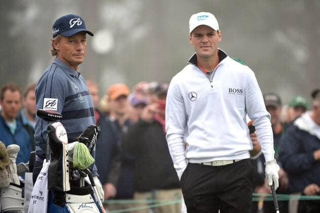 Bernhard Langer (L) and Martin Kaymer wait to hit off of the first tee during a practice round prior to the Masters golf tournament at Augusta National Golf Club in Augusta, George, April 7, 2014.  AUG20140407327