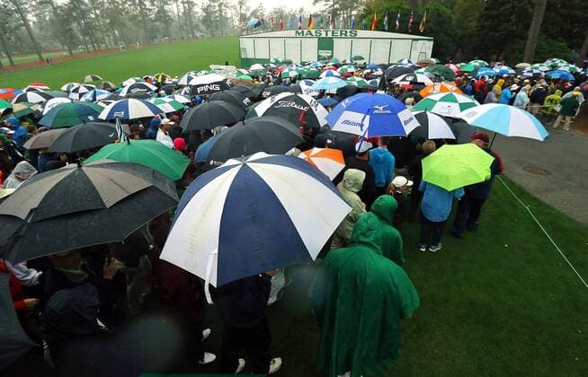 April 7, 2014 - Augusta, GA, USA - Masters patrons leave the course after play was suspended due to severe weather approaching the area at Augusta National Golf Club on Monday, April 7, 2014, in Augusta, Ga. Masters - ZUMAm67