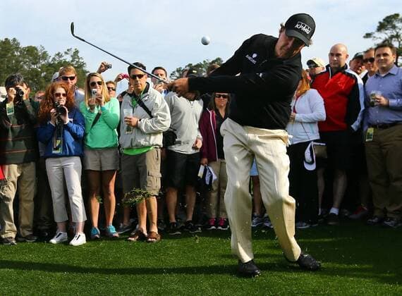 April 8, 2014 - Augusta, GA, USA - Phil Mickelson, who has been battling back pain and a pulled muscle, chips from the gallery into the sand trap at the seventh green during his practice round for the Masters at Augusta National Golf Club on Tuesday, April 8, 2014, in Augusta, Ga. PGA - ZUMAm67