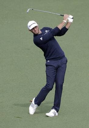 April 8, 2014 - Augusta, GA, USA - Dustin Johnson hits his approach shot on No. 9 during a practice round at Augusta National Golf Club on Tuesday, April 8, 2014, in Augusta, Ga. PGA - ZUMAm67