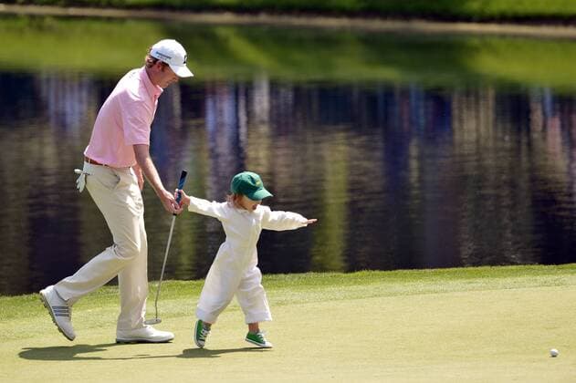 Brandt Snedeker his daughter Lily play on the ninth green during the Par 3 Contest during the Masters Tournament at Augusta National Golf Club in Augusta, Georgia, April 8, 2014.  AUG20140409358