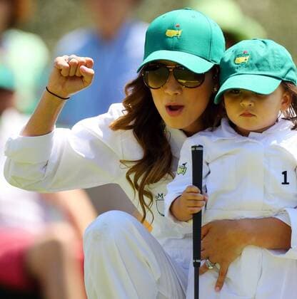 April 9, 2014 - Augusta, GA, USA - Jason Day s wife Ellie and son Dash, 21 month old, react as he sinks his birdie putt on the No.1 hole during the Par 3 Contest at Augusta National Golf Club in Augusta, Ga., on Wednesday, April 9, 2014. Masters Tournament - ZUMAm67
