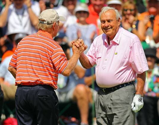April 9, 2014 - Augusta, GA, USA - Jack Nicklaus, left, slaps five with Arnold Palmer after sinking his birdie putt on the No. 1 hole during the Par 3 Contest at Augusta National Golf Club in Augusta, Ga., on Wednesday, April 9, 2014. Masters Tournament - ZUMAm67