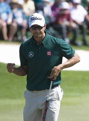 Adam Scott celebrates after making a putt to save par on the 18th green during the first round of the 2014 Masters Tournament at Augusta National Golf Club in Augusta, Georgia, April 10, 2014.  AUG20140410360