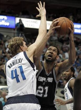 April 10, 2014 - Dallas, TX, USA - The San Antonio Spurs Tim Duncan (21) attempts a shot as the Dallas Mavericks Dirk Nowitzki (41) defends during the first half at the American Airlines Center in Dallas, on Thursday, April 10, 2014. The Spurs won, 109-100. San Antonio at Dallas - ZUMAm67