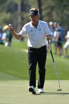 Bernhard Langer acknowledges the gallery after putting on the 3rd green during the second round of the 2014 Masters Tournament at Augusta National Golf Club in Augusta, Georgia, April 11, 2014. Watson finished seven under par.  AUG20140411337