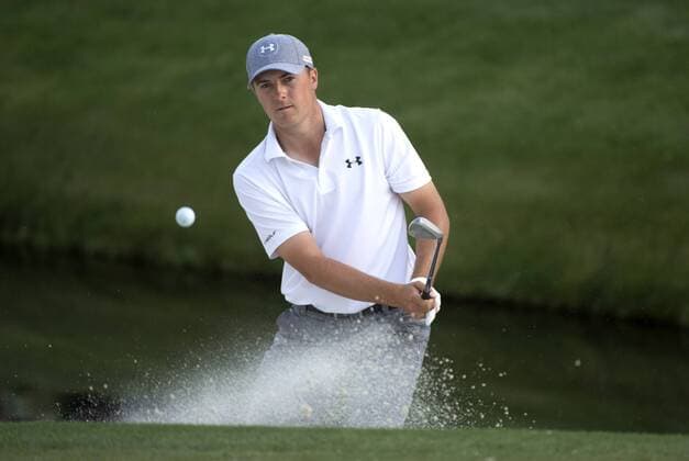 Jordan Spieth hits out of a bunker and onto the 16th green during the second round of the 2014 Masters Tournament at Augusta National Golf Club in Augusta, Georgia, April 11, 2014. Watson finished seven under par.  AUG20140411348