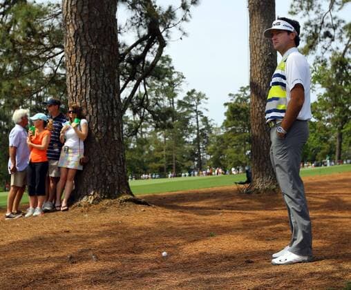 April 11, 2014 - Augusta, GA, USA - Bubba Watson checks his lie in the woods off the 9th fairway in the second round at the Masters Tournament in August, Ga., on Friday, April 11, 2014. Masters Tournament - ZUMAm67