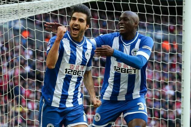 Wigan s Jordi Gomez celebrates scoring a penalty to open the scoring with Wigan s Marc-Antoine Fortune - Wigan v Arsenal - 2014 FA Cup Semi-Final - Wembley Stadium - London - 12th April 2014 - Pic Charlie Forgham-Bailey Sportimage EDITORIAL USE ONLY. No use with unauthorised audio, video, data, fixture lists, club league logos or live services. Online in-match use limited to 120 images, no video emulation. No use in betting, games or single club league player publications.