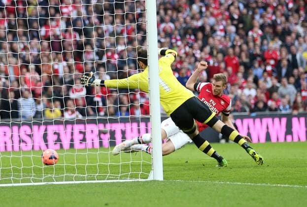 Arsenal s Per Mertesacker scoring his sides opening goal Wigan Athletic vs Arsenal- FA Cup Semi Final, Wembley Stadium - London - England - 12 04 2014 - Pic David Klein Sportimage EDITORIAL USE ONLY. No use with unauthorised audio, video, data, fixture lists, club league logos or live services. Online in-match use limited to 120 images, no video emulation. No use in betting, games or single club league player publications.