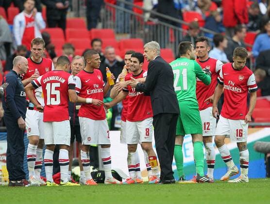 Arsenal s Arsene Wenger passes on instructions to his team before extra time Wigan Athletic vs Arsenal- FA Cup Semi Final, Wembley Stadium - London - England - 12 04 2014 - Pic David Klein Sportimage EDITORIAL USE ONLY. No use with unauthorised audio, video, data, fixture lists, club league logos or live services. Online in-match use limited to 120 images, no video emulation. No use in betting, games or single club league player publications.