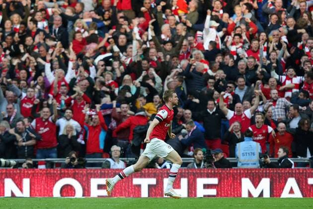 Per Mertesacker of Arsenal celebrates scoring the equaliser - Wigan v Arsenal - 2014 FA Cup Semi-Final - Wembley Stadium - London - 12th April 2014 - Pic Charlie Forgham-Bailey Sportimage EDITORIAL USE ONLY. No use with unauthorised audio, video, data, fixture lists, club league logos or live services. Online in-match use limited to 120 images, no video emulation. No use in betting, games or single club league player publications.