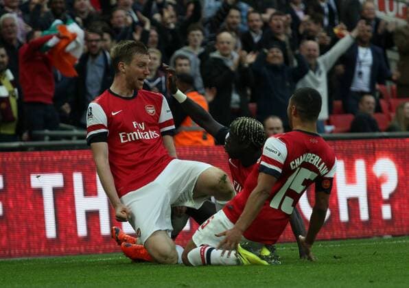 FA Cup Semi-Final - Arsenal v Wigan Athletic . . Wembley, London, UK . . 12.04.2014 Per Mertesacker (A) celebrates scoring a goal for Arsenal. 1-1 