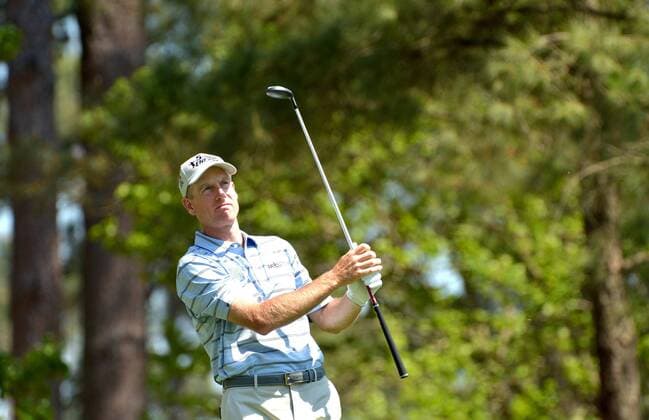 Jim Furyk hits a tee shot on the 4th hole in the third round of the 2014 Masters Tournament at Augusta National Golf Club in Augusta, Georgia on April 12, 2014.  AUG20140412311
