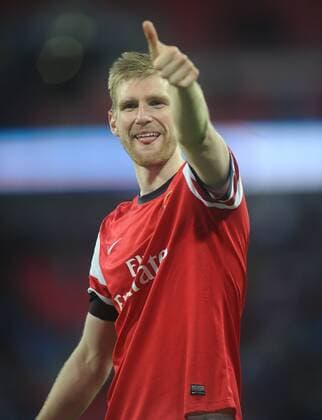 Football - 2013 2014 FA Cup - Semi-Final: Wigan Athletic vs. Arsenal Arsenal s Per Mertesacker celebrates at the end at Wembley. COLORSPORT ANDREW COWIE 