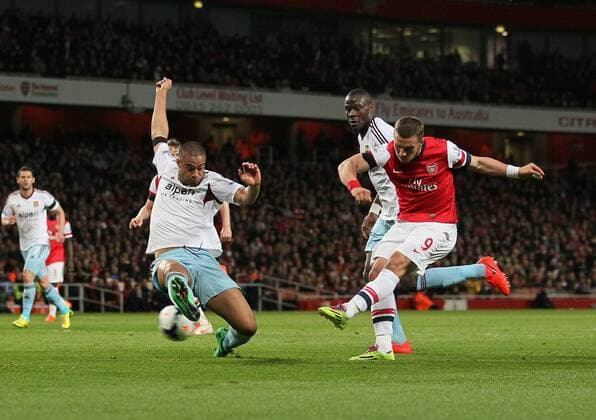 Arsenal s Lukas Podolski scoring his sides opening goal Arsenal vs West Ham United- Barclays Premier League - Emirates Stadium - London - England - 15 04 2014 - Pic David Klein Sportimage EDITORIAL USE ONLY. No use with unauthorised audio, video, data, fixture lists, club league logos or live services. Online in-match use limited to 120 images, no video emulation. No use in betting, games or single club league player publications.