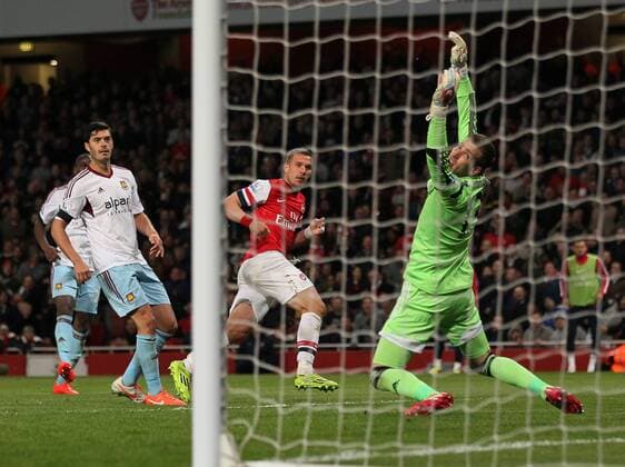 Arsenal s Lukas Podolski celebrates scoring his sides third goal Arsenal vs West Ham United- Barclays Premier League - Emirates Stadium - London - England - 15 04 2014 - Pic David Klein Sportimage EDITORIAL USE ONLY. No use with unauthorised audio, video, data, fixture lists, club league logos or live services. Online in-match use limited to 120 images, no video emulation. No use in betting, games or single club league player publications.
