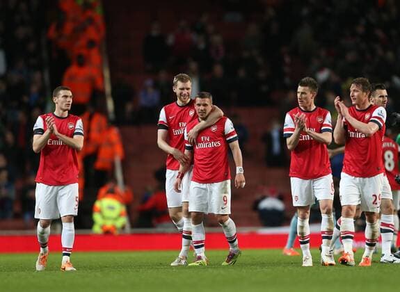 Arsenal s Lukas Podolski celebrates at the final whistle with Per Mertesacker Arsenal vs West Ham United- Barclays Premier League - Emirates Stadium - London - England - 15 04 2014 - Pic David Klein Sportimage EDITORIAL USE ONLY. No use with unauthorised audio, video, data, fixture lists, club league logos or live services. Online in-match use limited to 120 images, no video emulation. No use in betting, games or single club league player publications.