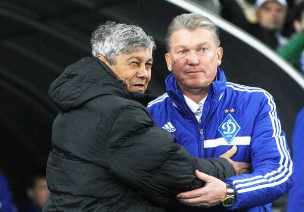 Head coach of FC Shakhtar Donetsk Mircea Lucescu (L) and head coach of FC Dynamo Kyiv Oleh Blokhin share an embrace during the Ukrainian Premier League Matchday 19 game at the NSC Olimpiyskiy in Kyiv, Ukraine, April 16, 2014. . 