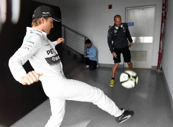 German F1 driver Nico Rosberg of Mercedes plays football ahead of the 2014 Formula One Chinese Grand Prix in Shanghai, China, 18 April 2014. Nico Rosberg plays football ahead of Chinese Grand Prix  20140418_10460