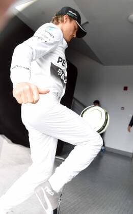 German F1 driver Nico Rosberg of Mercedes plays football ahead of the 2014 Formula One Chinese Grand Prix in Shanghai, China, 18 April 2014. Nico Rosberg plays football ahead of Chinese Grand Prix  20140418_46589