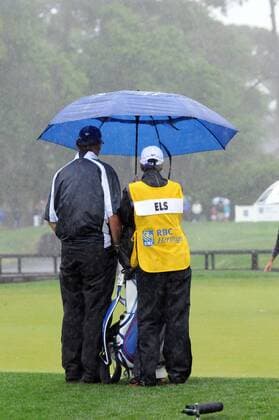 18 April 2014: Ernie Els watches and tries to stay dry before the delay of the very wet second round of the RBC Heritage presented by Boeing Golf Tournament, from Harbour Town Golf Links, on Hilton Head Island. GOLF: APR 18 PGA Golf Herren - RBC Heritage - Second Round Icon20120140418102 EDITORIAL USE ONLY
