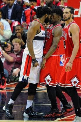 Washington Wizards forward Nene Hilario (42) puts his head against Chicago Bulls guard Jimmy Butler (21) in the second half of the third game of the first round of playoffs at the Verizon Center in Washington, D.C. on April 25, 2014. Nene was ejected after receiving a double technical foul as the Chicago Bulls defeated the Washington Wizards 100-97.  WAG2014042524