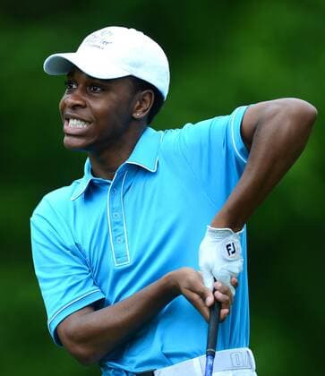 April 30, 2014 - Charlotte, NC, USA - Charlotte First Tee golfer DeAngelo Stowe watches the flight of his drive from the 12th tee box during the Wells Fargo Championship Pro-Am at Quail Hollow Club in Charlotte, N.C., Wednesday, April 30, 2014. Stowe was paired with professional golfer Webb Simpson. Wells Fargo Championship Pro-Am - ZUMAm67