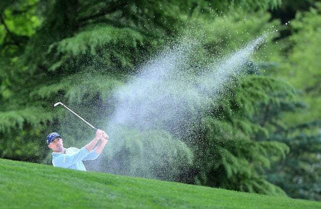 May 1, 2014 - Charlotte, North Carolina, U.S. - JONATHAN BYRD hits from a sand trap on the 15th hole during the Wells Fargo Championship Pro-Am at Quail Hollow Club. Golf 2014 - Wells Fargo Championship Pro-Am - ZUMAm67