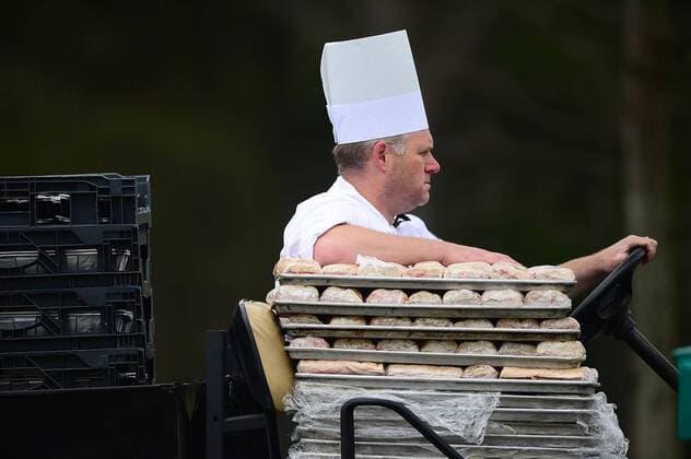 May 2, 2014 - Charlotte, NC, USA - A food service worker races sandwiches, via golf cart, to their destination during the second day of competition at the Wells Fargo Championship at the Quail Hollow Club in Charlotte, N.C., Friday, May 2, 2014. Wells Fargo Championship - ZUMAm67