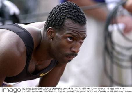 July 15, 2000 - U.S. - KRT SPORTS STORY SLUGGED: TRIALS KRT PHOTO BY LARRY STRONG CONTRA COSTA TIMES (July 15) SACRAMENTO, CA -- Michael Johnson looks at the clock after winning his heat at the 200-meters at the U.S. Olympic Trials Saturday (Digital image) (CC) PL KD 2000 (Horiz) (gsb) News Archive - July 15, 2000 - ZUMAm67