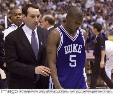 March 29, 1999 - U.S. - KRT SPORTS STORY SLUGGED: FINALFOUR KRT PHOTOGRAPH BY DAVID BERGMAN MIAMI HERALD (SUN-SENTINEL OUT) (KRT213) ST. PETERSBURG, FLORIDA March 29 - Duke head coach Mike Krzyzewski, left, walks off the court with William Avery, 5, after the Blue Devils were beat 77-74 by the UConn Huskies in the NCAA College League USA championship game at Tropicana Field, Monday. (MI) AP,PL,KD,BL 1999 (Horiz) (This is an electronic image) (Additional photos available on KRT Direct, KRT PressLink or upon request) (smd) News Archive - March 29, 1999 - ZUMAm67