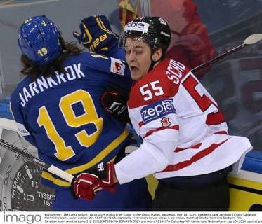 ITAR-TASS: MINSK, BELARUS. MAY 18, 2014. Sweden s Calle Jarnkrok (L) and Canada s Mark Scheifele in action in their 2014 IIHF World Championship Preliminary Round Group A ice hockey match at Chizhovka Arena Stadium. The Canadian team won the game 3:2.  premiumd RE14437A
