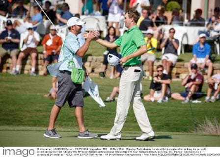 18 May 2014: Brendon Todd shakes hands with his caddie after sinking his par putt on 18 during the final round of the HP Byron Nelson Championship held at the TPC Four Seasons Resort in Irving, TX. Brendon Todd wins by 2 strokes at 14 under par. GOLF: MAY 18 PGA Golf Herren - HP Byron Nelson Championship - Final Round Icon140518744 EDITORIAL USE ONLY