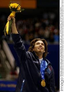 Feb. 20, 2002 - U.S. - NO MAGS, NO SALES -- KRT SPORTS STORY SLUGGED: OLY-SHORTTRACK KRT PHOTOGRAPH BY ERICH SCHLEGEL DALLAS MORNING NEWS (February 20) SALT LAKE CITY, UT-- Apolo Anton Ohno of the U.S.shows off his gold medal during the medal ceremony at the 2002 Winter Olympics men s 1500m short track speedskating finals at the Salt Lake Ice Center in Salt Lake City, Wednesday, Feb. 20, 2002. Ohno won the gold medal when apparent winner Korean skater Dong-Sung Kim was disqualified for impeding. (DA) BL NC KD 2002 (Vert) (lde) News Archive - Feb. 20, 2002 - ZUMAm67