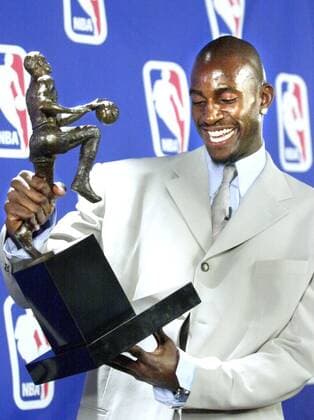May 3, 2004 - U.S. - KRT SPORTS STORY SLUGGED: BKN-MVP KRT PHOTOGRAPH BY JOE ROSSI ST. PAUL PIONEER PRESS (May 3) MINNEAPOLIS, MN -- Kevin Garnett of the Minnesota Timberwolves examines the Maurice Podoloff Trophy after being presented the trophy as the NBA s Most Valuable Player Monday at the Target Center in Minneapolis, Minnesota, on May 3, 2004. (cdm) 2004 News Archive - May 3, 2004 - ZUMAm67