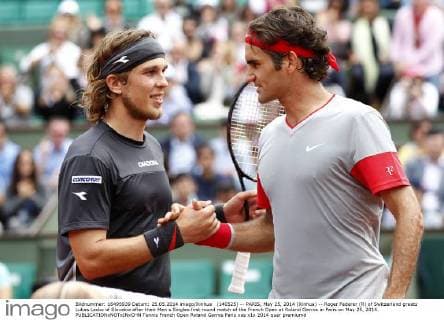 (140525) -- PARIS, May 25, 2014 (Xinhua) -- Roger Federer (R) of Switzerland greets Lukas Lacko of Slovakia after their Men s Singles first round match of the French Open at Roland Garros in Paris on May 25, 2014. 