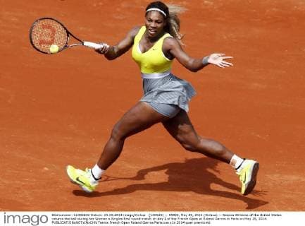 (140525) -- PARIS, May 25, 2014 (Xinhua) -- Serena Williams of the United States returns the ball during her Women s Singles first round match on day 1 of the French Open at Roland Garros in Paris on May 25, 2014. 