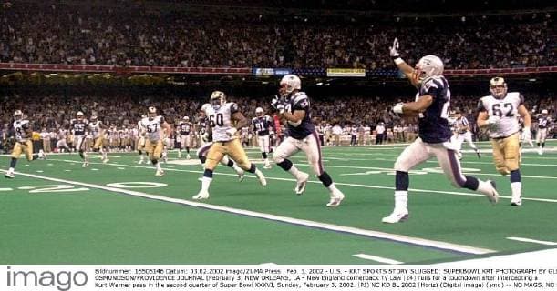 Feb. 3, 2002 - U.S. - KRT SPORTS STORY SLUGGED: SUPERBOWL KRT PHOTOGRAPH BY GLENN OSMUNDSON PROVIDENCE JOURNAL (February 3) NEW ORLEANS, LA - New England cornerback Ty Law (24) runs for a touchdown after intercepting a Kurt Warner pass in the second quarter of Super Bowl XXXVI, Sunday, February 3, 2002. (PJ) NC KD BL 2002 (Horiz) (Digital image) (smd) -- NO MAGS, NO SALES News Archive - Feb. 3, 2002 - ZUMAm67